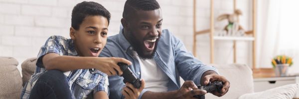 Father and son playing videogames